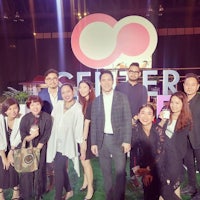 a group of people posing for a photo at an event